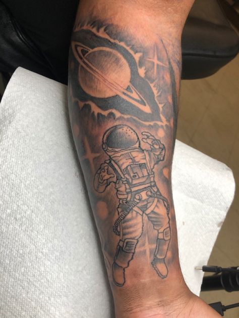 Astronaut with Saturn tattoo outer space Mens Upper Sleeve Tattoo, Astronaut Tattoos For Men, Space Filler Tattoo Sleeve, Tattoo Of Saturn, Men’s Space Tattoo, Mens Space Tattoos, Astronaut Sleeve Tattoo, Outer Space Tattoo Ideas, Space Theme Tattoo Ideas