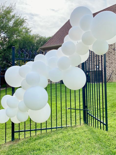 Balloon Garland On Fence, Fence Balloon Decor, Balloons On Fence, Garland On Fence, White Balloon Garland, Short Fence, Skating Party, Roller Skating Party, Balloon Installation