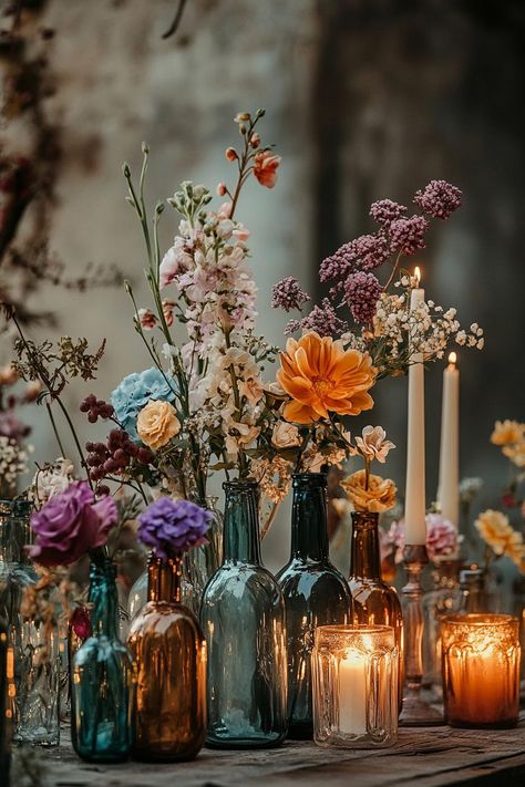 Vintage Decor For Party, Color Candles Wedding, Floral Boho Centerpieces, Eclectic Fall Wedding Decor, Wedding Table Decor Inspiration, Simple Vintage Centerpieces, Antique Bottle Centerpieces Wedding, Wildflower Wedding Centerpiece Round Table, Late Summer Wedding Centerpieces