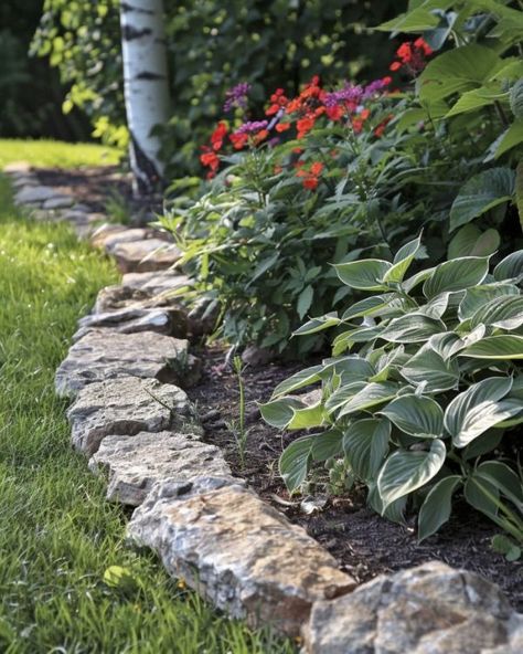 9 beautiful garden bed edging ideas Natural Stone Flower Bed Edging, Stone Garden Bed Edging, Natural Stone Garden Border, Rock Borders Edging Garden Beds, Rock Lined Flower Bed, Rock Landscape Edging, Flower Bed Trim, Flowerbed Border Ideas, Unique Garden Edging Ideas