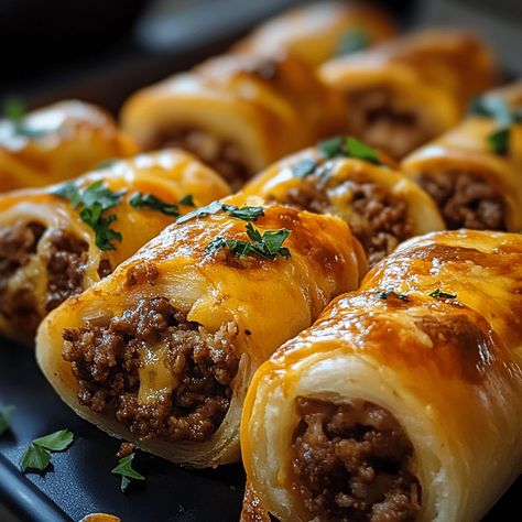 Cheesy Beefy Rolls-Up feature seasoned ground beef, melted cheese, and soft tortillas, creating a delicious and satisfying snack. Sloppy Joe Roll Ups, Ground Beef Rolled Tacos, Ground Beef Recipes With Croissants, Cheesy Beefy Rolls, Ground Beef Roulade, Beef Roll Ups With Cream Cheese, Cheesy Ground Beef Delight Wrap, Ground Beef With Crescent Rolls, Cheese Burger Wraps Ground Beef