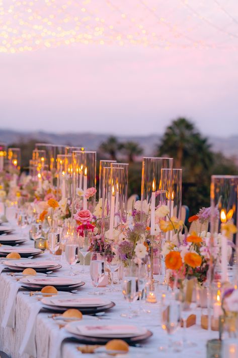 Wedding Color Schemes Romantic, Elaborate Wedding Florals, Colored Glasses Wedding Table, Meadow Wedding Aesthetic, Wedding Flowers Summer Centerpieces, Wedding Table Settings Colorful, Multicolor Wedding Flowers, Wedding Tablescapes Candles, Long Table Floral Arrangements