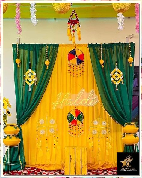 If you're looking for creative and affordable wedding decorations, check out our collection! We've got all the supplies you need to create beautiful decorations on a budget. Backdrop For Haldi Function, Haldi Wallpaper Background, Mehandi Theme Decor, Haldi Background Decoration At Home, Simple Haldi Backdrop At Home, Mehandi Function Decoration At Home, Haldi Function Decoration At Home Simple, Haldi Decoration Ideas Simple, Haldi Backdrop At Home