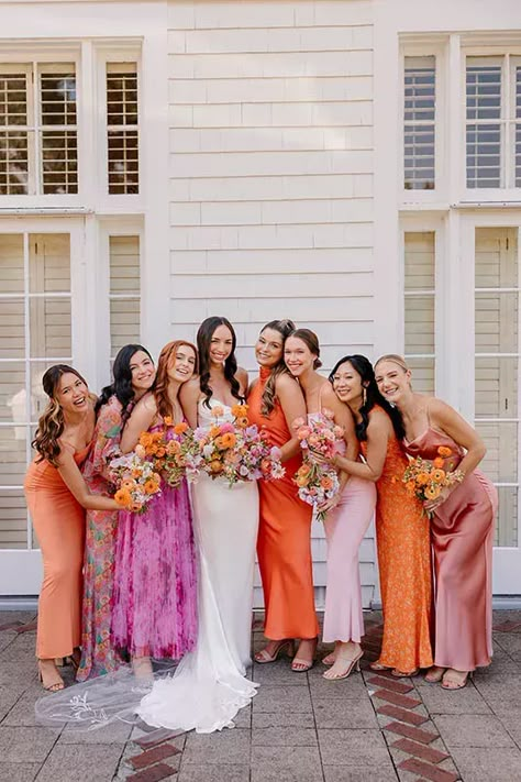 bride with bridesmaids in mix matched brightly colored dresses Neutral Wedding Party With Bright Flowers, Multi Colored Bridesmaid Dresses Summer, Bright Mixed Bridesmaid Dresses, Bridesmaid Dresses Mismatched Colorful, Bridesmaid Dresses Not Matching, Bright Boho Bridesmaid Dresses, Mix Match Purple Bridesmaid Dresses, Colourful Mismatched Bridesmaids, Sunset Color Palette Bridesmaids