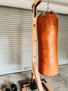 How To Hang Your MVP Leather Heavy Punching Bag – MODEST VINTAGE PLAYER LTD Diy Punching Bag, Home Dojo, Boxing Bag Stand, Punching Bag Stand, Heavy Bag Stand, Homemade Gym, Homemade Gym Equipment, Backyard Gym, Boxing Punching Bag