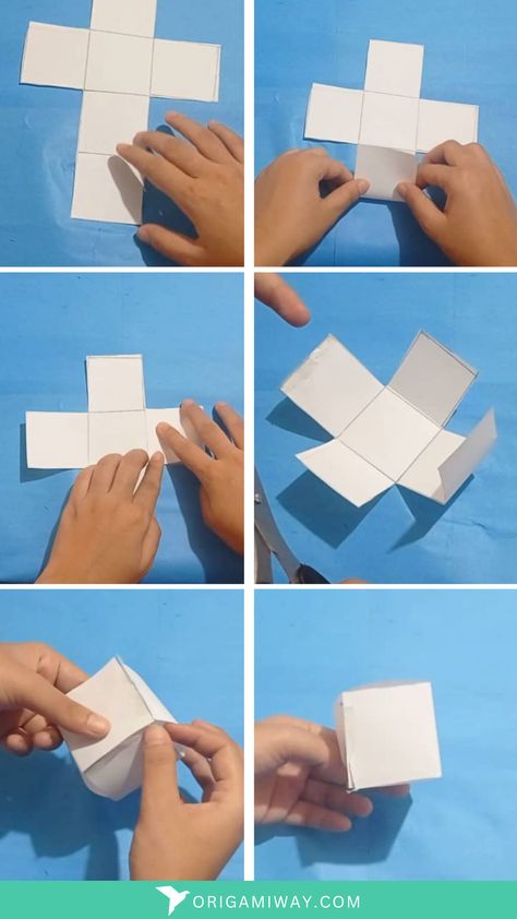 A white paper origami cube Make A Cube Out Of Paper, Cube Making With Paper, How To Make Cubes Out Of Paper, 3d Cube Template, Paper Cube Origami, How To Make Square Box With Paper, Paper Cube Diy, Origami Cube Tutorial, How To Make Cube With Paper