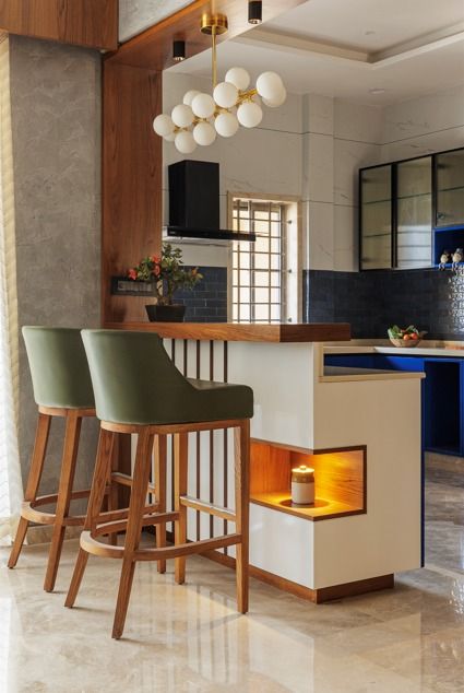 A Saga of a Sustainable Home Intertwining a Profound Love for Nature | Angana Studio Breakfast Counter Design, Kitchen With Breakfast Counter, Breakfast Counter, Breakfast Counter In Kitchen, Modular Kitchen Indian, 2 Story House Design, Kitchen Indian, Kitchen Chimney, Modular Kitchen Design