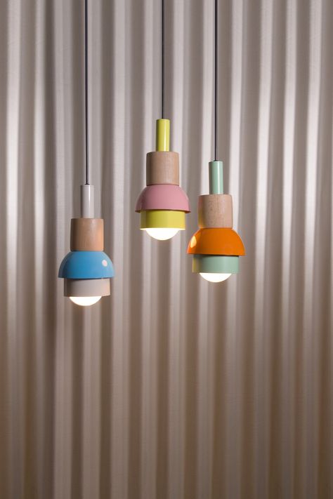 What sets our iconic style product apart is not only its vibrant colors and playful design, but also our commitment to sustainability. We proudly refrain from using plastic packaging, and ensure that 97% of our product is handmade with care. The remaining 3% is reserved for the electrical cables that make these lights shine. Transform your living space with our stunning pendant light chandelier. Handcrafted with precision and care, this elegant piece will illuminate any room with a warm and invi Colorfull Lamp, Pendant Chandeliers, Colorful Lamp, Colorful Pendant Light, Colorful Chandelier, Wood Light Fixture, Colorful Lamps, Add Color To Your Home, Plug In Pendant Light