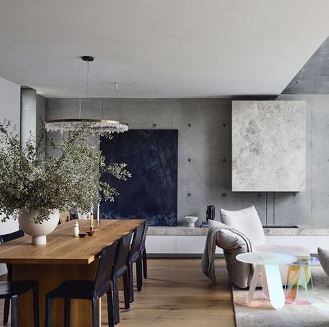 Contemporary living room with wood dining table, concrete wall, fireplace and wood floors #contemporarydesign #designinspiration #concretewall #concrete #diningarea #design #interiordesign #interiordesigner Concrete Interiors, Modernist Architects, Living Photo, Concrete Walls, Concrete Home, Victorian Cottage, Concrete House, Ideas For House, Australian Homes