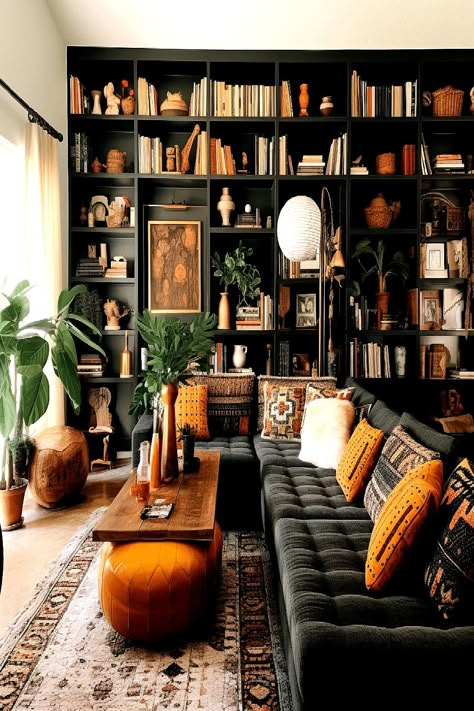 Dark wood bookshelf adding classic charm to a bohemian living room on a budget. 70s Living Room, Modern Bohemian Living Room, Moody Living Room, Bohemian Living Rooms, Decor Western, Interior Design Per La Casa, Living Room On A Budget, Bohemian Living Room, Design Del Prodotto