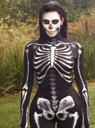 SKELETON: Show off your curves without showing any flesh in this skeleton costume worn by Kim Kardashian West. Get the look with a black body suit decorated with white paint. Get more Halloween inspiration from your favorite celebs here! Kardashian Halloween Costume, Kim Kardashian Halloween, Skeleton Costume Diy, Halloween Costumes Pictures, Gothic Halloween Costumes, Halloween Costumes 2014, Best Celebrity Halloween Costumes, Celebrity Costumes, Celebrity Halloween