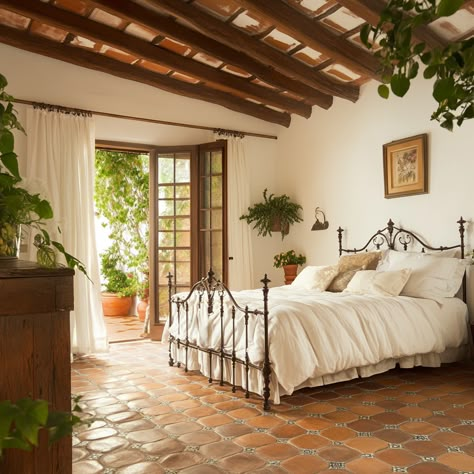 Rustic beams and terracotta tones can make anything  feel earthy. Saltillo Tile Bedroom Spanish Style, Terracotta Bedroom Floor, Spanish Style Decor Bedroom, Spanish House Bedroom, Terracotta Floor Bedroom, Spanish Style Master Bed, Hacienda Bedroom Mexican Style, Saltillo Tile Bedroom, Spanish Style Bedrooms