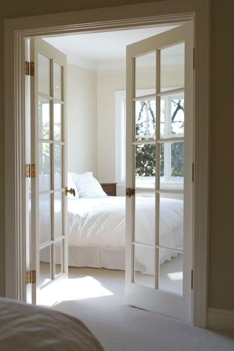 Add a touch of elegance to your bedroom with classic French doors for your closet. These beautiful doors enhance the room’s sophistication while providing easy access. 🚪🌿✨ #FrenchDoors #ElegantLiving #BedroomDesign #ElevatedCloset Small Bedroom With French Doors, French Door For Bedroom, Types Of French Doors, Classic Door Design French Style, French Doors In Bedroom To Outside, French Doors Apartment, Walk In Closet French Doors, French Doors To Master Bed, French Sliding Door Interior