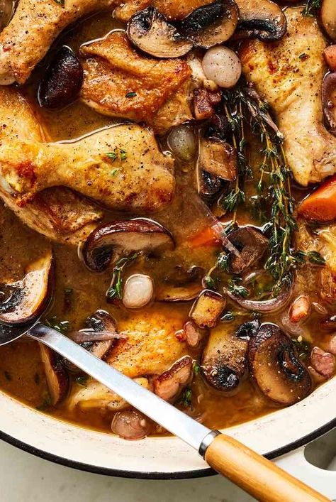 This deeply savory coq au vin recipe from Ina Garten is made with whole chicken cut into pieces, mushrooms, pearl onions, Cognac, and Burgundy. One Pot Coq Au Vin, Coq Au Vin Recipe Ina Garten, White Wine Coq Au Vin, Ina Roasted Chicken, French Chicken Stew Coq Au Vin, White Wine Coq Au Vin Recipe, Chicken Cocovan Coq Au Vin, Chicken Coq Au Vin Recipe Easy, Cou Au Vin Chicken