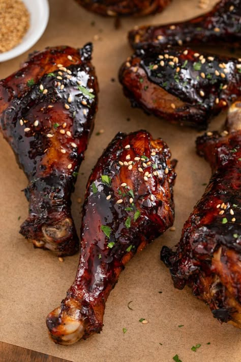 These sweet & sticky baked chicken drumsticks are the perfect appetizer or easy dinner! Tender chicken legs are coated in a sticky, addictive glaze packed with Asian flavors and baked until juicy. These are absolutely the BEST baked drumsticks! How Long To Bake Chicken Drumsticks, Asian Style Chicken Drumsticks, Soy Sauce Drumsticks, Chicken Leg Recipes With Potatoes, Chicken Drumstick Oven Recipes, Chinese Chicken Drumstick Recipes, Japanese Chicken Drumsticks, Sweet And Sticky Chicken Drumsticks, Teriyaki Chicken Legs Oven