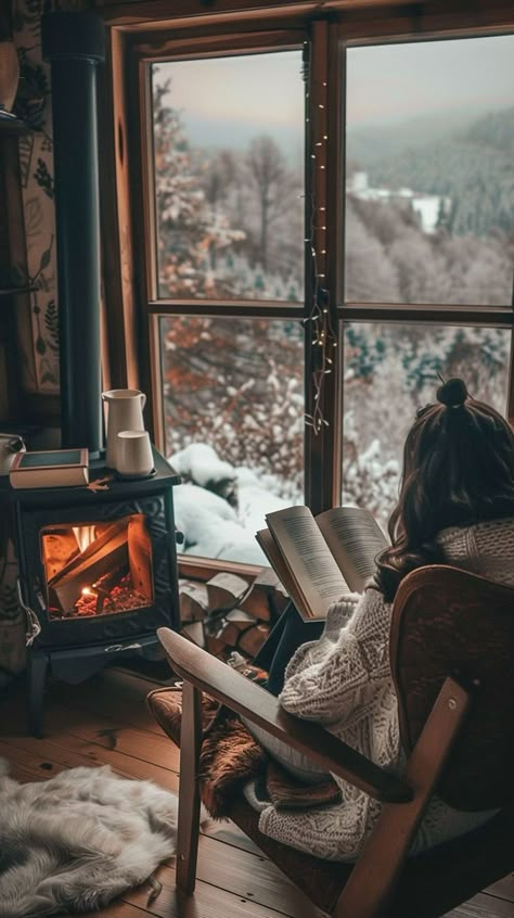 Tranquil cabin winter reading nook with cozy blanket, fireplace, and snowy tree view. Winter Mood Board, Cozy Life, Winter Mood, Winter Cabin, Cozy Fireplace, Winter Vibes, Cabin Life, Elegant Interiors, Cozy Reading Nook