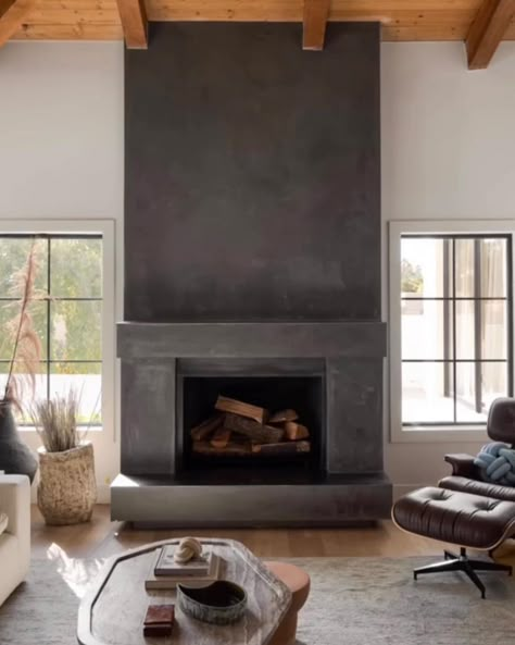 | This hand-plastered fireplace by @compoundconcrete, designed by @iconicbykaitlynwolfe, is your gorgeous reminder that the coziness of… | Instagram Rustic Wood Burning Fireplace, Concrete Fireplace With Wood Mantle, Plastered Fireplace, 2 Story Fireplace Ideas, Fireplace With Wood Mantle, Air Bnb Cabin, Gas Fireplace Ideas, Farmhouse Fireplace Ideas, Plaster Fireplace