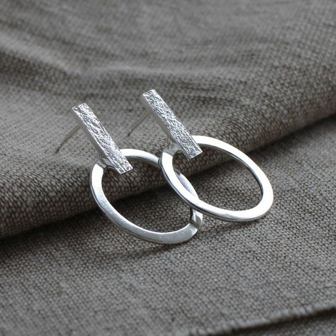 Reflections earrings. Light to wear and the ring moves subtly when worn. Handmade with either a hammered or stone texture. Which would you choose? ♻️ All my jewellery is made completely from 100% certified recycled silver Modern Silver Earrings, Texture Jewelry, Wire Jewelry Earrings, Huggie Earrings Silver, Handmade Silver Jewellery, Metalwork Jewelry, Contemporary Earrings, Silver Jewelry Design, Silver Jewellery Sets