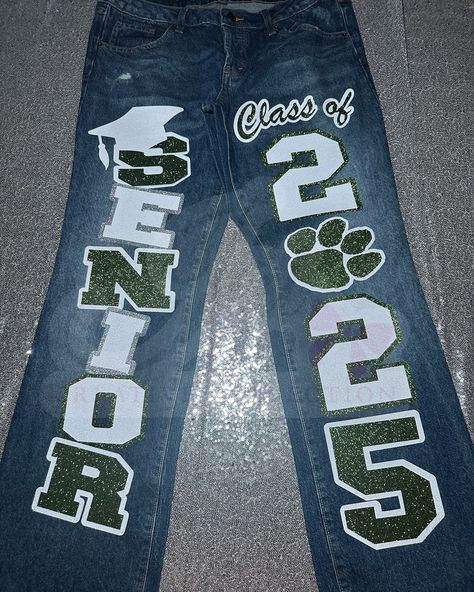 CUSTOM JEANS 💚🩶🤍 customized by @jaicreativecollection 🎀 —————————— DM or TEXT (313)318-0114 to place an order📲 ✨ —————————— (JEANS👖 PROVIDED BY CUSTOMER! CUSTOMIZATION FEE $65!) —————————— #senior2025 #2025 #seniorszn #classof2025 #jaicreativecollection🎀 #seniorsets #customseniorjeans #seniorjeans #detroitsmallbusiness #trojans #customizedjeans ##seniorskirt #customseniorjeans #panthers Black Senior Jeans, Senior 2025 Jeans, Senior Pants 2025, Senior Pants Ideas 2025, Senior Jeans Ideas High Schools, Senior Pants Ideas, Senior Pants High Schools, Senior Jeans Painted, Homecoming Jeans Ideas