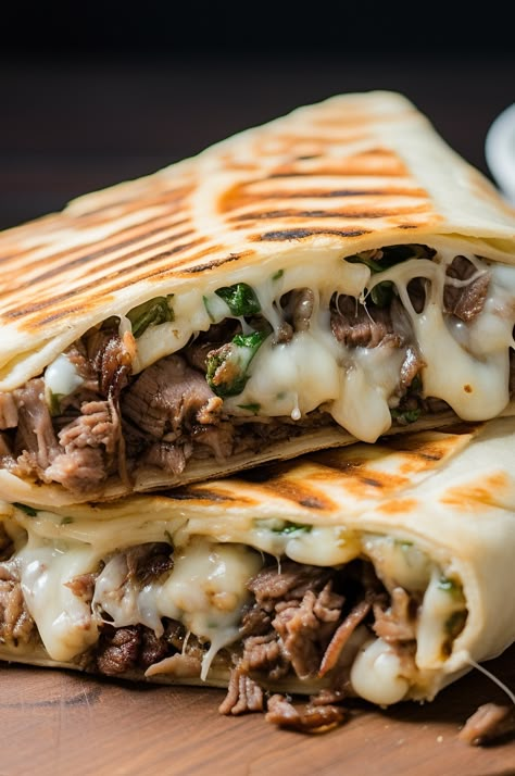 A delicious and easy-to-make grilled wrap filled with all the flavors of a Philly Cheesesteak sandwich. Cheesesteak Wrap Philly, Philly Steak Wraps Recipes, Cheesesteak Dinner Ideas, Grilled Tortilla Sandwiches, Philly Cheesesteak Burrito, Keto Philly Cheesesteak Wraps, Philly Cheese Wraps, Camping Philly Cheese Steak, Philly Cheese Crunchers