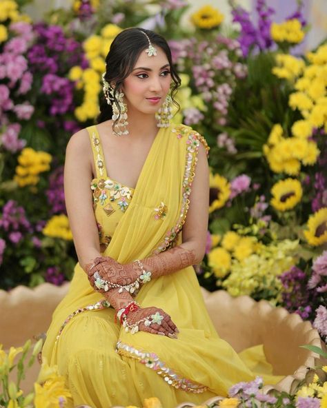 Ending the day with another sunshine beauty giving Haldi outfit inspiration in this beautiful yellow sharara saree dress. Her haldi dress is seeking attention and swipe to see the gorgeous sea shell accessories and floral braid, which will also make you say wow. 💛 Bride @rachnashah4 Makeup @makeoverbyindu Hair @hairbydeepak Photographer @memoirs_jaipur Follow @wishnwed for more such Haldi outfits ideas. #indianweddings #weddingideas #weddinginspiration #indianwedding #bride #groom #wedd... Groom Haldi Decoration, Bride Haldi Dress, Haldi Outfits Ideas, Bride Haldi Outfit, Haldi Dress For Bride Indian, Haldi Outfit For Men, Lehenga For Haldi Ceremony, Haldi Photoshoot Poses, Haldi Dress For Groom