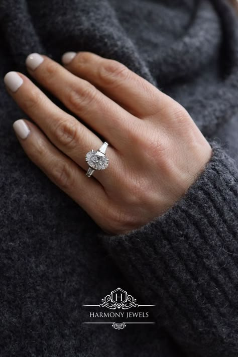 #ovaldiamondring #ovaldiamondengagementring #diamondengagementring #londonjewellery #custommade #harmonyjewelsldn Oval Diamond With Baguette Side Stones, Oval Tapered Baguette Engagement Ring, Oval With Tapered Baguettes, Oval Baguette Engagement Ring, Oval Engagement Ring With Baguettes, 2ct Oval Engagement Ring, White Gold Oval Engagement Ring, Marriage Dresses, Tapered Engagement Ring