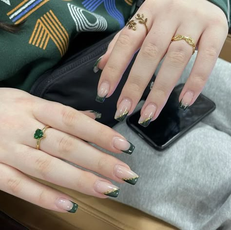 Green And Gold Tips Nails, Green With Gold French Tip Nails, Dark Green And Grey Nails, Green French Nails With Gold, Emerald Green Dress Nails Ideas, Emerald Green Accent Nails, Dark Emerald Green French Tip Nails, Emerald Green Nails By Skin Tone Range, Dark Green Glitter French Tip Nails