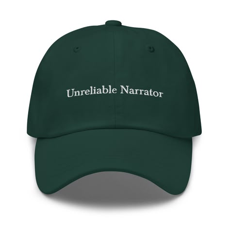 "One of our personal favorite literary draws, the Unreliable Narrator hat is designed especially for those of us who have a soft spot for our hero who is just as confused as we are.  Available in 5 colors, we'll see you in the fit updates. * 100% chino cotton twill * Unstructured, 6-panel, low-profile * 6 embroidered eyelets * 3 ⅛\" (7.6 cm) crown * Adjustable strap with antique buckle" Cheap Streetwear Baseball Cap, Cheap Fun Dad Hat Baseball Cap, Adjustable Cotton Dad Hat, Cheap Baseball Cap For Fan Merchandise, Casual Cheap College Dad Hat, Cheap Flat Brim Baseball Cap As Gift, Cheap Funny Cap Style Hat, Cheap Themed Cap, Funny Hat Ideas