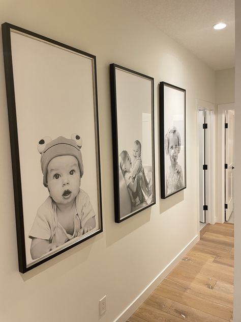 4 Large Photos On Wall, Family Pictures Stairs, Vertical Photo Wall, Living Room Wall Family Picture Ideas, 20x30 Picture On Wall, Family Wall Photos Display, Hall Photo Wall Ideas, Black And White Photo Gallery Wall, Big Photo Frame Ideas