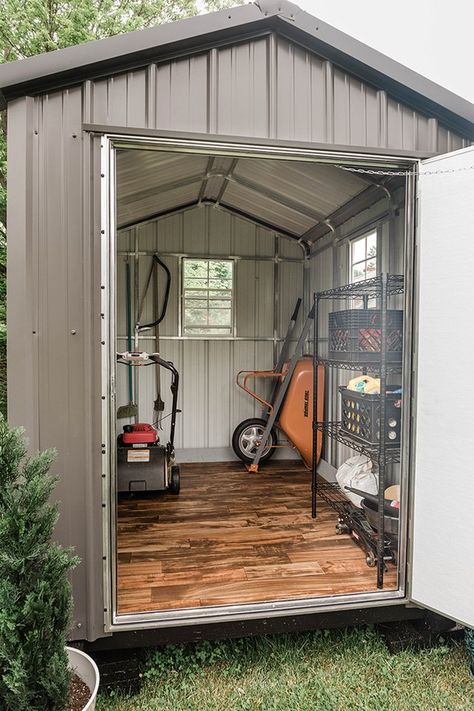 If you're planning on buying a shed for your outdoor tools, but don't love the look of it, you can easily make some adjustments so it's easier on the eyes. And best of all? It won't break your bank. Click for seven tips. Diy Metal Shed, Metal Shed Makeover, Sheds Ideas Backyard, Cool Sheds, Outdoor Shed, Shed Makeover, Shed Interior, Garden Tool Shed, Small Sheds