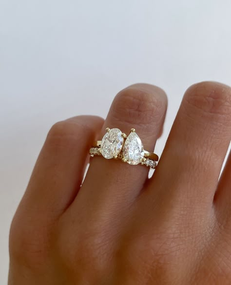 PEAR-fection✨ Pears look gorgeous on all finger types, it's defiantly one of the most versatile stone shapes!⁠ ⁠ ⁠ Ring Details:⁠ Aspen… | Instagram Oval And Pear Engagement Ring With Wedding Band, Pear Duet Engagement Ring, Wedding Rings Engagement Pear Shaped, Oval Pear Engagement Ring, Two Stones Ring, Pear And Oval Engagement Rings, Large Pear Engagement Ring, Elaborate Engagement Rings, Diamond Shaped Wedding Rings