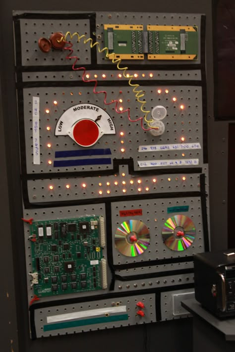 Light board/panel - command center Peg board Space Command Center, Diy Mission Control Panel, Inside Of A Spaceship, Rocket Ship Control Panel, Sci Fi Decorations, Space Control Panel, Stellar Vbs Decorations, Vbs Stellar Decorations, Vbs Space Theme Decorations