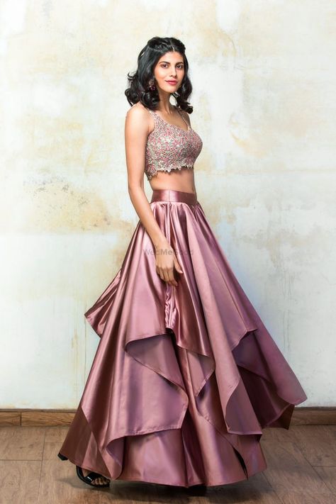 Rose pink satin layered lehenga by Izzumi Mehta Satin Lehenga Party Wear, Satin Dresses Indian Wear, Lehanga Designs Satin, Pink Satin Lehenga, Satin Layered Dress, Skirts Traditional Indian, Layered Lehenga Indian Outfits, Satin Traditional Outfit, Satin Traditional Dress