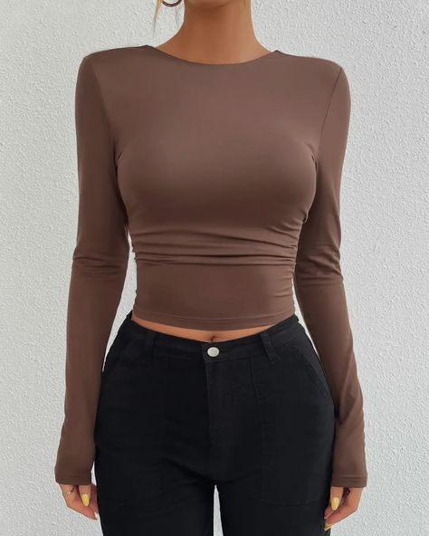 NEW - Sculpt Backless Long Sleeve Crop Under $30 Sleek, sultry, and effortlessly chic—the Sculpt Backless Long Sleeve Crop is the essential statement piece your wardrobe needs. Featuring a body-hugging fit with long sleeves and a striking open-back design, this top is perfect for day-to-night transitions. The rich brown color adds a warm, earthy tone to your outfit, while the upcoming black version will bring a sleek, versatile option to your collection. Pair it with high-waisted pants... Outfits With Brown Top, Full Sleeves Top, Night Out Tops, Brown Shirt, Long Sleeved Top, Top Outfit, Brown Top, Coffee Brown, Solid Clothes