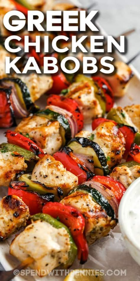 This recipe for Greek chicken kabobs makes a delicious meal with rice and yogurt tzatziki. Chucks of chicken are placed in a tangy Greek-style marinade made with garlic, lemon, oregano, and olive oil. Then thread them onto shish kabob skewers, alternating with red onion, colorful bell peppers, and zucchini. This dish is fresh, summery, low in calories, and packed with nutrition! #greekchickenkabobs #chickenkabobs #greek #recipe #spendwithpennies Greek Kebab, Rice And Yogurt, Marinated Chicken Kabobs, Greek Yogurt Marinated Chicken, Chicken Kabob Marinade, Greek Chicken Kebabs, Meal With Rice, Greek Chicken Skewers, Chicken Shish Kabobs