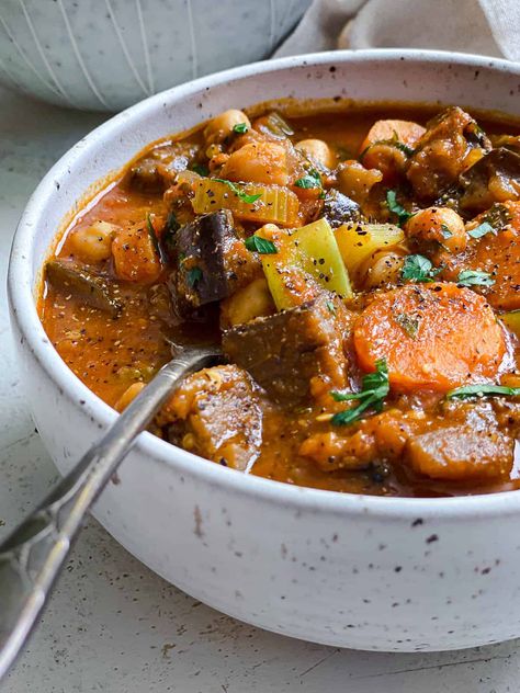 This Eggplant Stew is packed with flavor, fiber, & plant-based protein but made entirely of affordable kitchen staples! So easy to make and perfect for a weeknight comfort meal! #plantbasedonabudget #eggplant #stew Guyana Recipes, Stew With Tomatoes, Eggplant Soup, Eggplant Stew, New Dinner Recipes, Soup Cleanse, New Recipes For Dinner, Kitchen Staples, Happy Gut