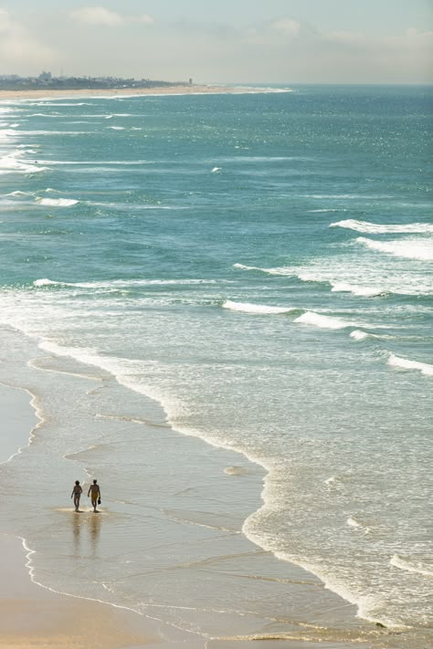 A couple walk on the beach at Conil de la Frontera, in Andalucia. Beach Walk Couple, Walking By The Beach, Ear Acupressure, Couple At The Beach, Dear Girl, Walking Along The Beach, Ear Seeds, Walking Beach, Walks On The Beach