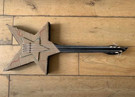 How To Make Guitar With Cardboard, Cardboard Electric Guitar, How To Make A Guitar Out Of Cardboard, Star Shaped Guitar, Cool Things To Do With Cardboard, Rockstar Crafts, Fun Cardboard Crafts, Cardboard Guitar Diy, What To Make With Cardboard