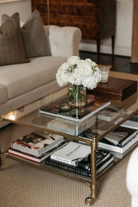 how to style a coffee table Style A Glass Coffee Table, Gold Glass Coffee Table Decor, Traditional Coffee Table Styling, Styling Glass Coffee Table, Styling A Glass Coffee Table, Nancy Meyers Coffee Table, Decorate Coffee Table Ideas, Glass Coffee Table Decor Ideas, Rectangular Coffee Table Styling