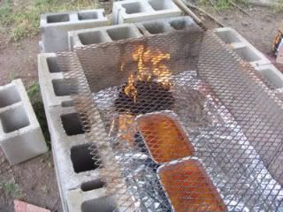 How to use cinderblocks to build a temporary back-yard barbecue pit to smoke a whole hog - for that BIG summer party :-) Inexpensive & super-simple to build & take down: see this link http://cowgirlscountry.blogspot.com/2007/03/cooking-whole-hog-on-cinder-block-pit_19.html Outdoor Cooking Pit, Backyard Smokers, Backyard Bbq Pit, Bbq Pit Smoker, Cinder Block Fire Pit, Brick Bbq, Barbecue Pit, Pavers Backyard, Cinder Blocks