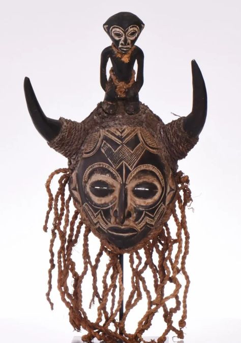 African Chokwe Mask, Wood Carved Adorned With Animal Horns And A Small Child Figure As A Top Center Piece. Estimated more than 100 yrs old. Angola Africa, Animal Horns, Animal Masks, Wood Carved, Carving, Mask, Wood, Animals, Art