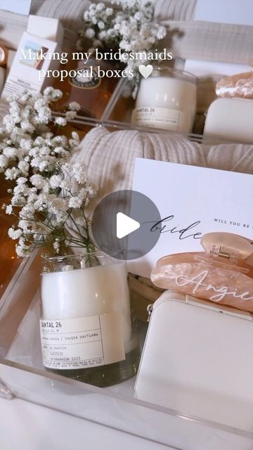 iluvsarahii on Instagram: "Packing my bridesmaids proposal boxes 🤍 I filled them in with things that I love that I know they will truly love as well. 

@parachutehome Cloud Quilt Robe
@miraval Rose 
@lelabofragrances Santal 33 Candle 
@luxunfiltered N24 Hand Cream 
@summerfridays Lip Balm 
@maisonmargielafragrances Replica Beach walk fragrance 
@ginnecarow Jewelry +  Jewelry Case 
@cb2 Martini Glasses 
Custom boxes, hair clips and cards from @etsy" Miraval Rose, Quilt Robe, Bridal Proposal Box Ideas, Bridesmaids Proposal Boxes, Replica Beach Walk, Cloud Quilt, Bridesmaid Proposal Box Ideas, Proposal Box Ideas, Bridal Proposal