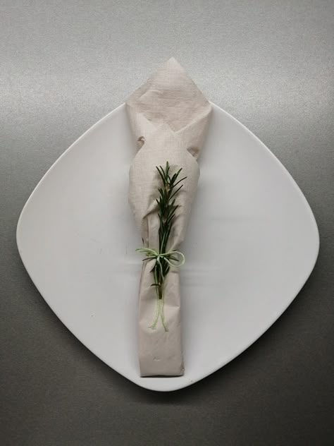 Paper napkin with  rosemary. Paper Napkins Table Setting, Christmas Napkin Folding Paper, Paper Napkin Folding Ideas Christmas, Napkin Folding Ideas Paper, Paper Napkin Folding Ideas, Christmas Napkin Folding, Napkin Folding Ideas, Paper Napkin Folding, Dinner Party Table Settings