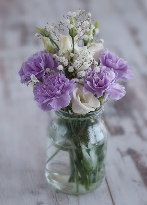 I don't like carnations, but I really like this arrangement. Purple Mason Jars, Purple Wedding Centerpieces, Purple Centerpieces, Purple Bridal Shower, Purple Bouquets, Elegant Wedding Centerpiece, Purple Wedding Bouquets, Bridal Shower Centerpieces, Spring Wedding Colors