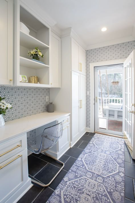 Laundry room with built in work desk. #laundryroom #builtindesk #workspace #Bluewallpaper #desk #whitecabinets Laundry Room Desk Built Ins, Laundry Desk Combo, Laundry Room Library, Laundry Desk Area, Built In Desk Laundry Room, Desk Laundry Room, Mud Room Desk Built Ins, Mudroom With Desk Area, Office Space In Laundry Room