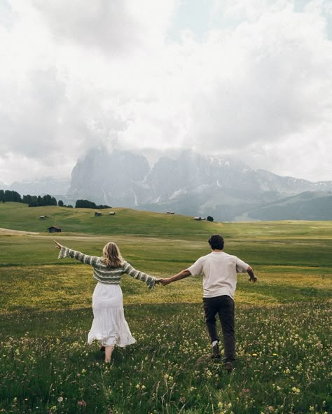 two lovers running through the meadows of the italian dolomites • • • keywords: documentary photography, cinematic photography, visual poetry, storytelling, love, couples photoshoot, tampa elopement, travel photographer, couples inspo, romcom, movie scenes, italy, dolomites, dolomites photos 🏷️ #floridaphotographer #tampaphotographer #stpeteweddingphptographer #tampaweddingphotographer #destinationweddingphotograoher #stpetephotographer #film #visualpoetry #cinematicphotographer #floridaw... Outdoor Couple Poses, Tampa Elopement, Dolomites Wedding, Outdoor Couple Photoshoot, Couple Travel Photos, Italian Dolomites, Florida Destination Wedding, Photography Cinematic, Wedding Photo Studio