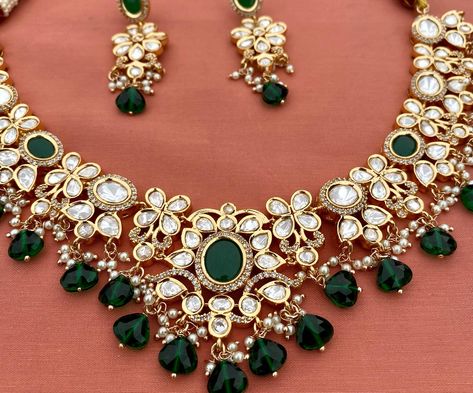 Tyaani inspired uncut polki emerald green necklace set. #statementjewelry #fashion #trendy #weddingseason #jewelry #earrings #weddingjewelry #gift #fashionjewelry #nehabhasin #punjabiwedding #indianwedding #india #pakistan #canada #vancouver #toronto #brampton #usa #california #bayarea #sanfrancisco #texas #dallas #houston #newyork #chicago #sanantonio #florida #gehnagalleryusa Artificial Jewellery India, Green Necklace Set, Emerald Green Necklace, Canada Vancouver, Texas Dallas, Artificial Jewellery, Punjabi Wedding, Jewellery Necklace, Green Necklace