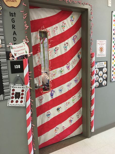 Had the kids color candy canes and we put a candy cane garland around the door, and pool noodles on the sides. We painted white butcher paper to make the candy cane shape Candy Cane Christmas Door Decorations, Candy Cane Lane Classroom Door, Candy Cane Door Decorations Classroom, Candy Cane Office Decorations, Candy Cane Lane Hallway Decorations, Candy Cane Office Theme, Candy Cane Hallway Decorations, Candy Cane Classroom Decorations, Candy Cane Lane Door Decorations