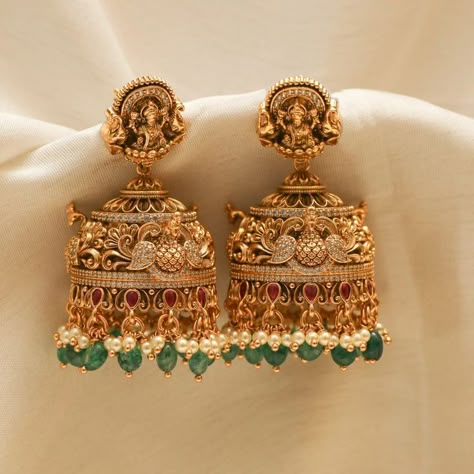 Show off India's culture and tradition by wearing perfectly handcrafted temple jewellery jhumkas! Explore our temple jewellery collection! Latest Design Earrings Gold, Gold Wedding Earrings Indian, Lakshmi Jhumkas Gold, Gold Antique Jhumkas, Lakshmi Buttalu Earrings Gold, Cz Earrings Indian Gold, Temple Jewellery Earrings Antique, Jumka Earrings Gold Indian Jewelry, Temple Earrings Gold Jewelry