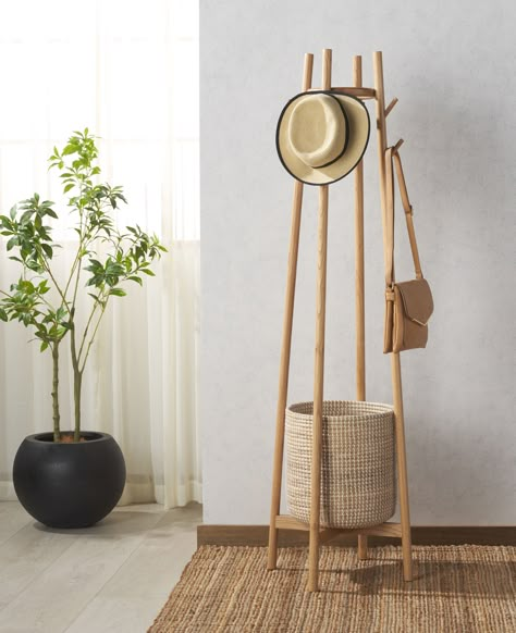 Keep your entryway neat and inviting with our Abellina coat rack with storage basket. Packing maximum storage within a sleek and charming profile, our coat rack remains a welcoming and handy addition to your home. The slim Oak wood poles lend a touch of warmth to our space-friendly coat rack. It features a woven basket to embrace a natural appeal and dose of practicality. Our chic and inviting coat rack includes eight hooks to hold your coats, totes, and hats while the basket remains perfect for Coat Hanger Decor, Decorative Coat Rack, Small Coat Rack Ideas Entryway, Bag Rack Ideas, Diy Coat Rack Stand, Coat Rack Ideas, Rack Decor, Coat Rack With Storage, Diy Coat Rack